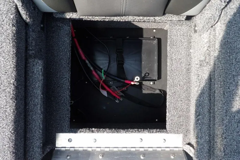 Slide: The Image of Battery compartment of 2026 Lund 2075 Pro-V Bass XS boat, featuring wiring and secure placement. - 12