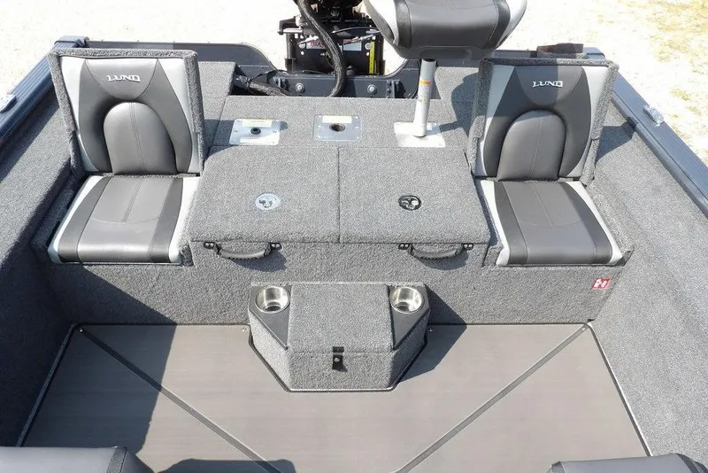 Slide: The Image of 2026 Lund 2075 Pro-V Bass XS boat interior with seating and storage compartments. - 14