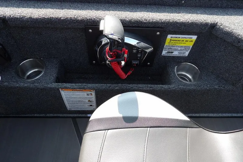Slide: The Image of Interior of 2026 Lund 2075 Pro-V Bass XS boat with control panel and cup holders. - 29