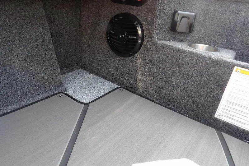 Slide: The Image of Interior of 2026 Lund 2075 Pro-V Bass XS boat with speaker and cup holder. - 32