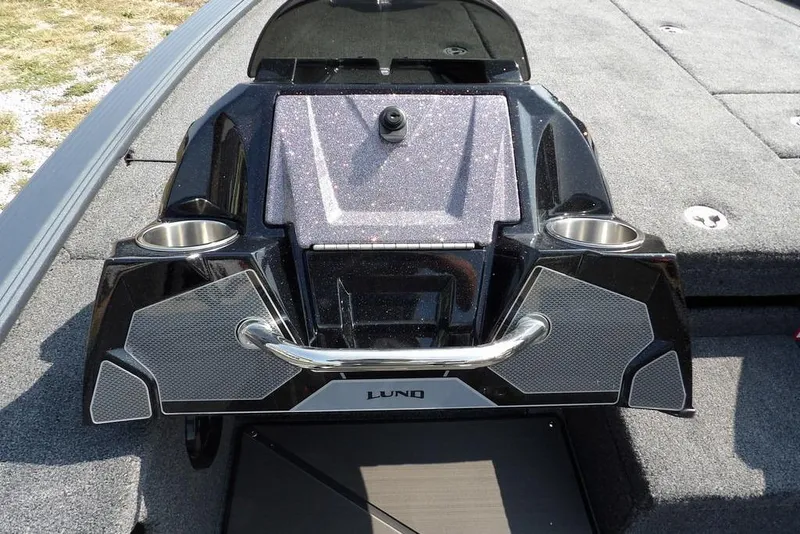 Slide: The Image of 2026 Lund 2075 Pro-V Bass XS boat console with cup holders and sleek design. - 34