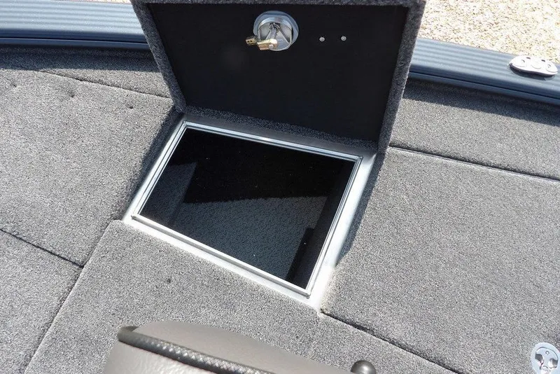 Slide: The Image of 2026 Lund 2075 Pro-V Bass XS boat storage compartment with open hatch. - 43