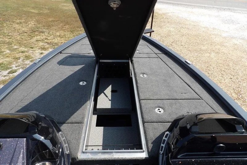 Slide: The Image of 2026 Lund 2075 Pro-V Bass XS boat with open storage compartment on deck. - 44