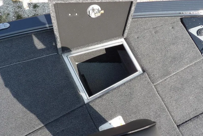 Slide: The Image of Open storage compartment on 2026 Lund 2075 Pro-V Bass XS boat deck. - 47