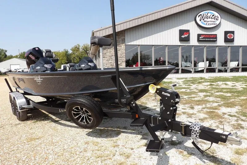 Slide: The Image of 2026 Lund 2075 Pro-V Bass XS boat on trailer at marine center. - 48