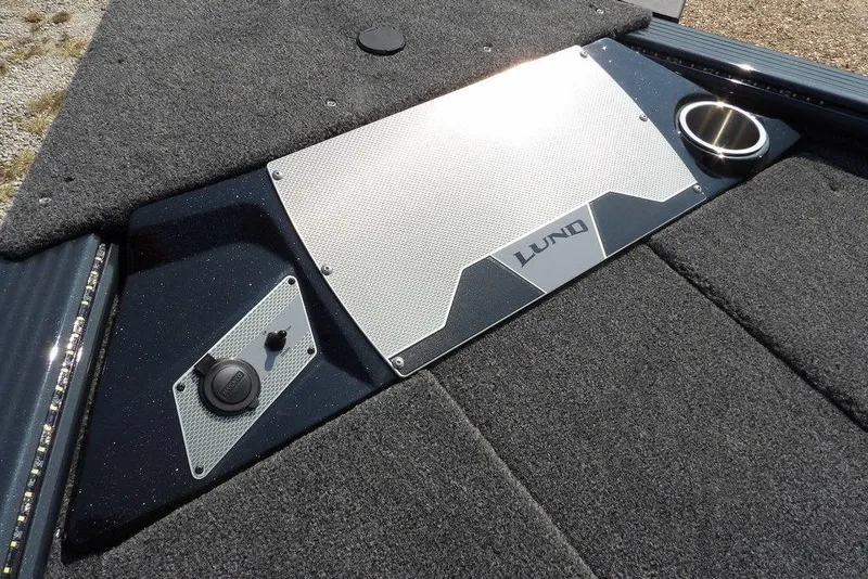 Slide: The Image of 2026 Lund 2075 Pro-V Bass XS boat deck with sleek design and cup holder. - 49