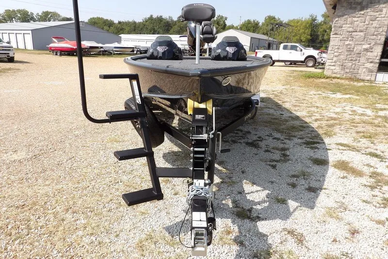 Slide: The Image of 2026 Lund 2075 Pro-V Bass XS boat on trailer in outdoor lot. - 5
