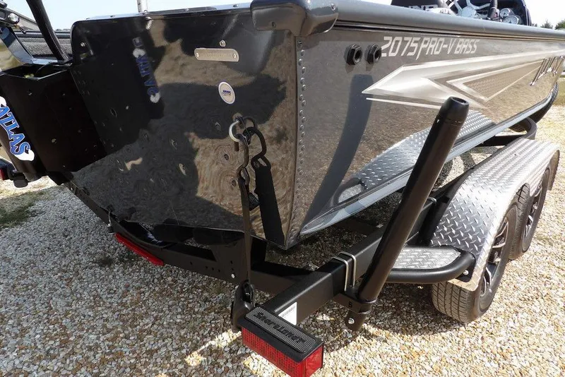 Slide: The Image of 2026 Lund 2075 Pro-V Bass XS boat on a trailer, rear view. - 56