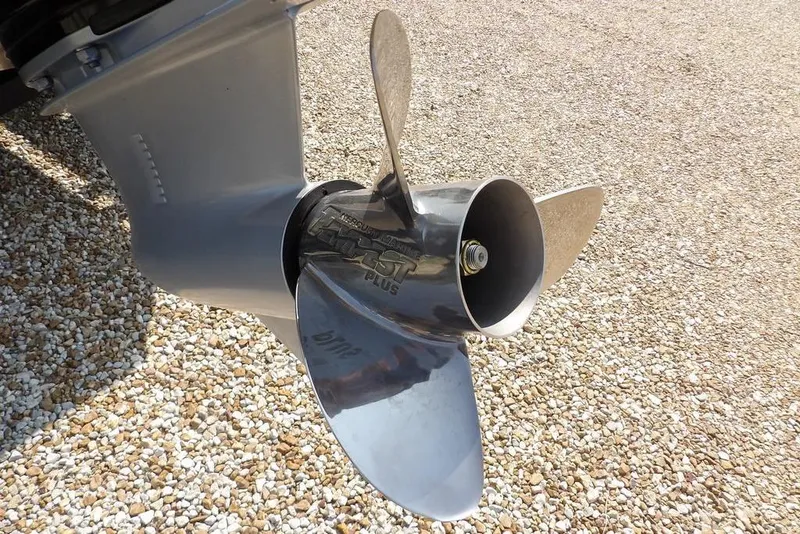 Slide: The Image of Propeller of 2026 Lund 2075 Pro-V Bass XS on gravel surface. - 59