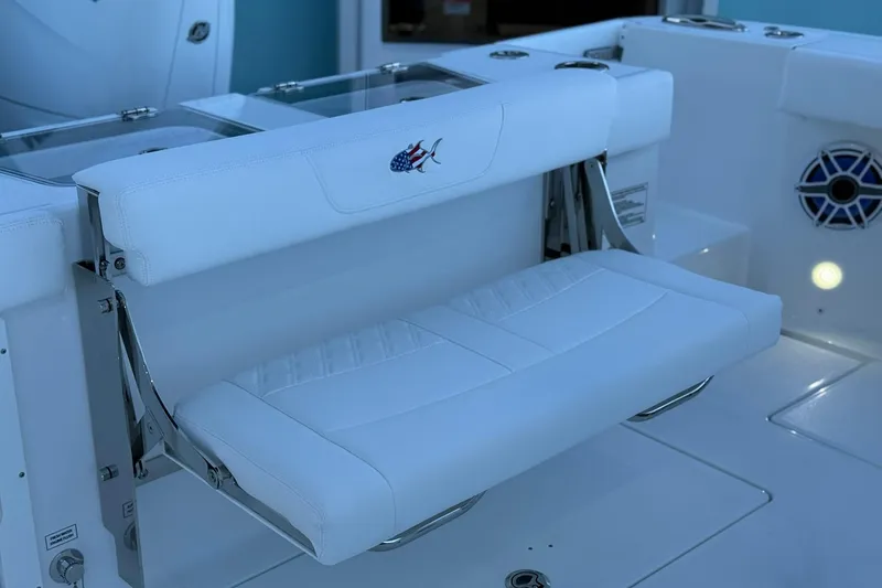 Slide: The Image of 2026 Crevalle 33 CSF boat with white cushioned seating and sleek design. - 13