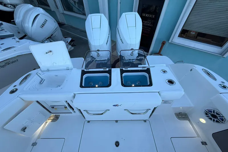 Slide: The Image of 2026 Crevalle 33 CSF boat with dual outboard engines and fishing station. - 15