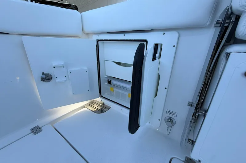 Slide: The Image of Open storage compartment on 2026 Crevalle 33 CSF boat, showcasing interior design and functionality. - 16