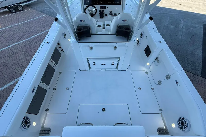 Slide: The Image of 2026 Crevalle 33 CSF boat interior, featuring spacious deck and modern controls. - 19