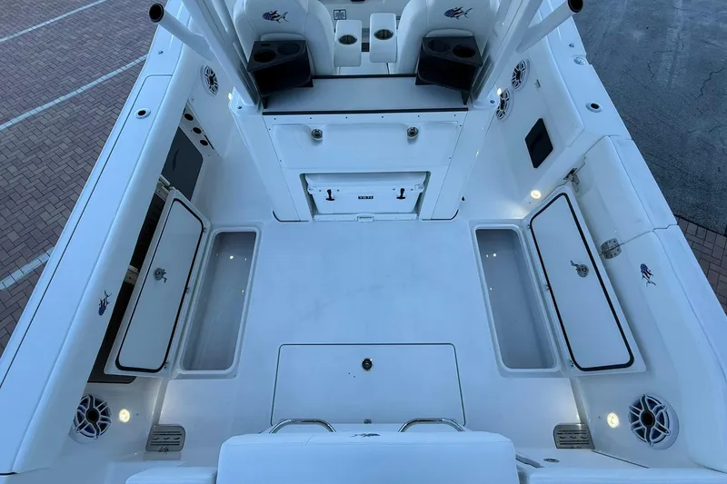 Slide: The Image of 2026 Crevalle 33 CSF boat deck with storage compartments and seating. - 20