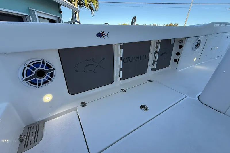 Slide: The Image of 2026 Crevalle 33 CSF boat interior with speaker and storage compartments. - 21
