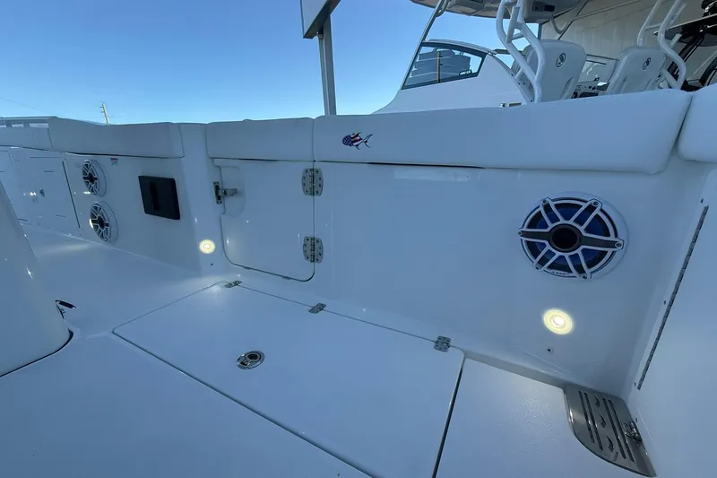 Slide: The Image of 2026 Crevalle 33 CSF boat interior with speakers and seating, showcasing modern design. - 22