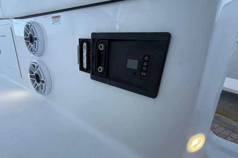 Slide: The Image of 2026 Crevalle 33 CSF boat interior with speakers and control panel. - 24