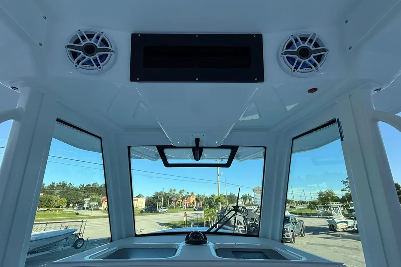 Slide: The Image of Interior view of 2026 Crevalle 33 CSF boat with speakers and windshield. - 29