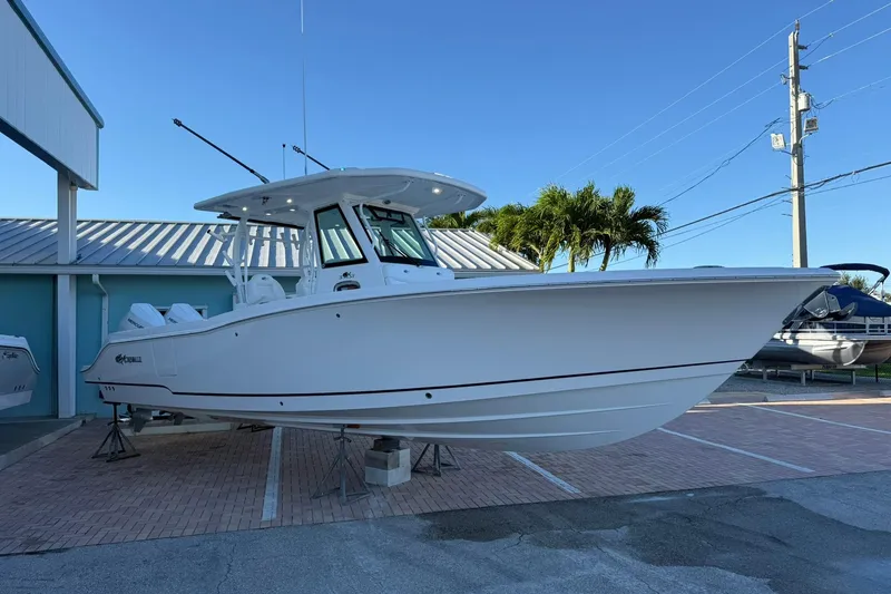 Slide: The Image of 2026 Crevalle 33 CSF boat displayed outdoors on a sunny day. - 3
