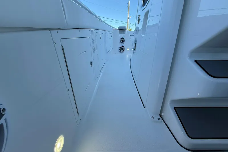 Slide: The Image of 2026 Crevalle 33 CSF boat interior with sleek white design and modern features. - 33