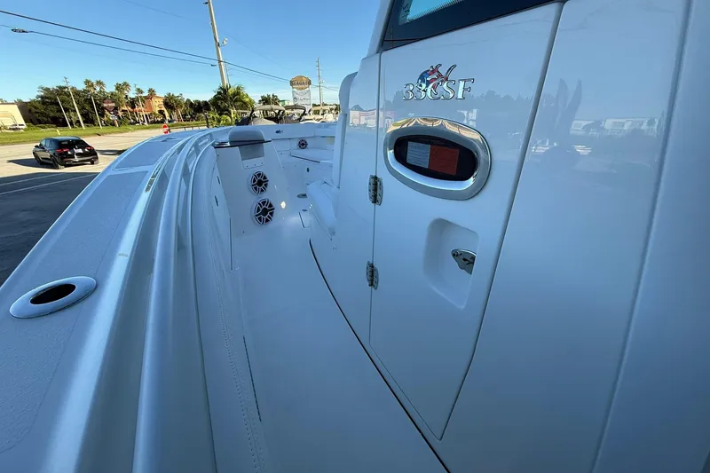 Slide: The Image of 2026 Crevalle 33 CSF boat interior with speakers and storage compartments. - 38
