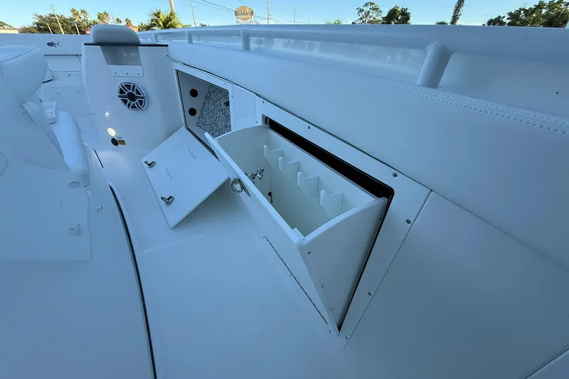 Slide: The Image of 2026 Crevalle 33 CSF boat interior with storage compartments and speaker system. - 42