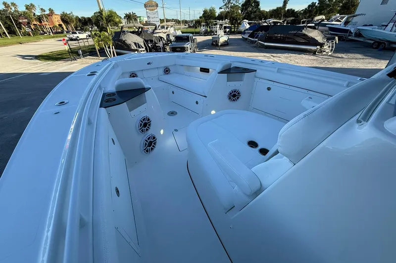 Slide: The Image of 2026 Crevalle 33 CSF boat interior with seating, speakers, and storage compartments. - 44