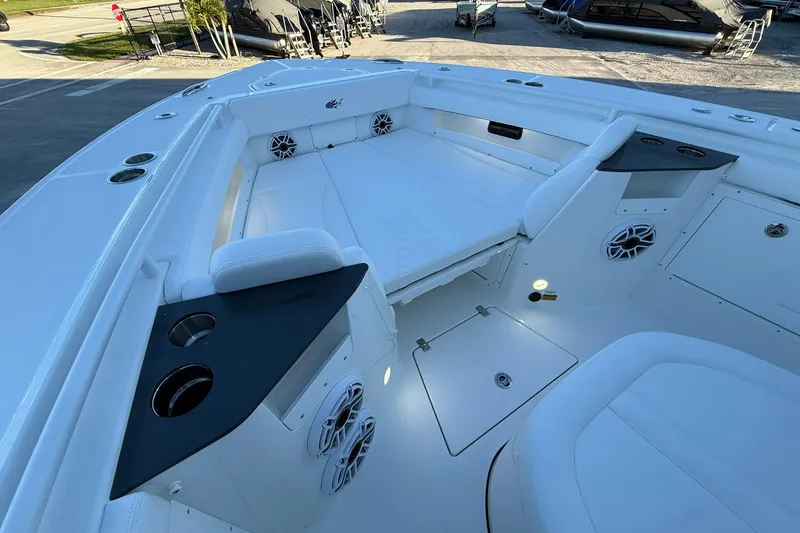 Slide: The Image of 2026 Crevalle 33 CSF boat interior with seating, cup holders, and speakers. - 47