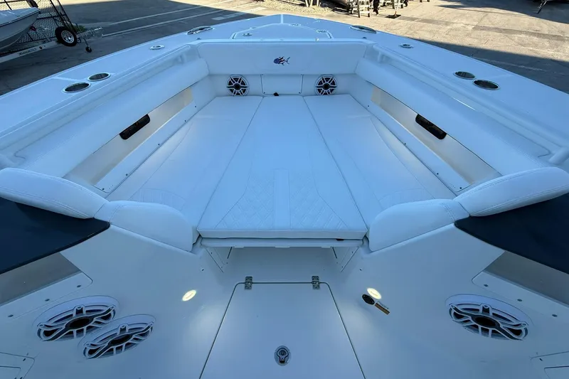 Slide: The Image of 2026 Crevalle 33 CSF boat interior with spacious white seating and modern design. - 49