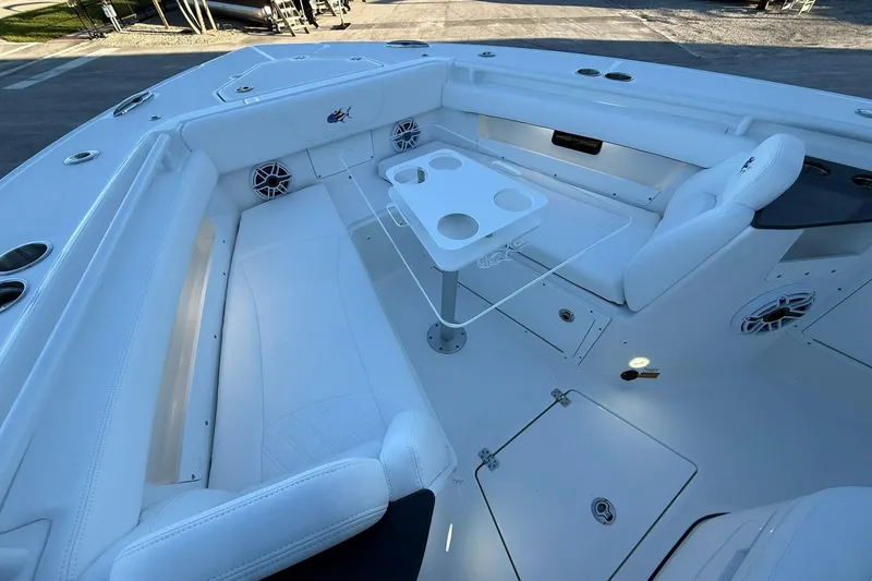 Slide: The Image of Luxurious interior of 2026 Crevalle 33 CSF boat with white seating and table. - 50