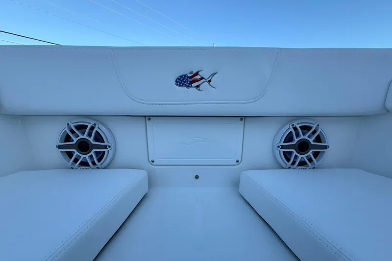 Slide: The Image of 2026 Crevalle 33 CSF boat interior with speakers and American flag fish logo. - 57