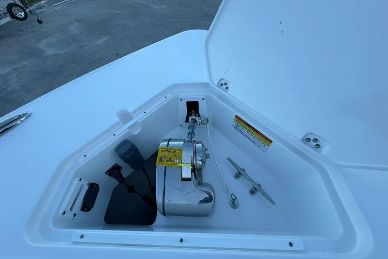 Slide: The Image of Anchor compartment of 2026 Crevalle 33 CSF boat, featuring chain and cleat. - 59