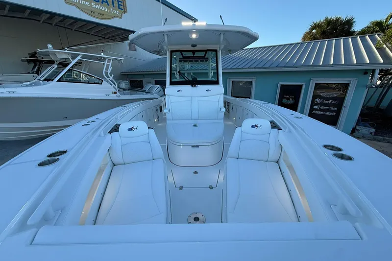 Slide: The Image of 2026 Crevalle 33 CSF boat with sleek white seating and modern design. - 60