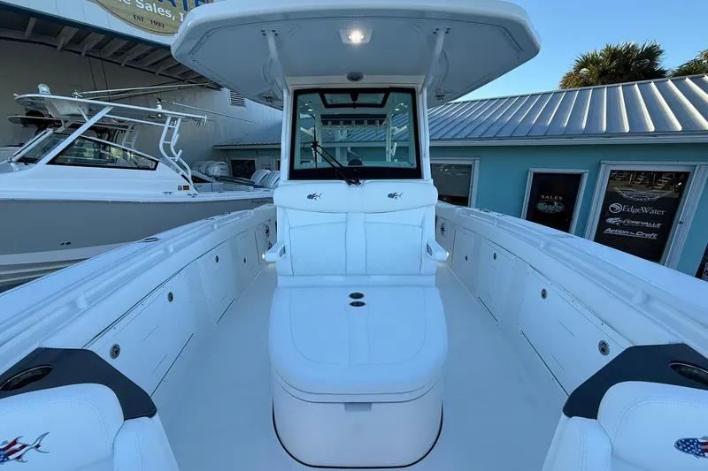 Slide: The Image of 2026 Crevalle 33 CSF boat interior with white seating and modern design. - 63