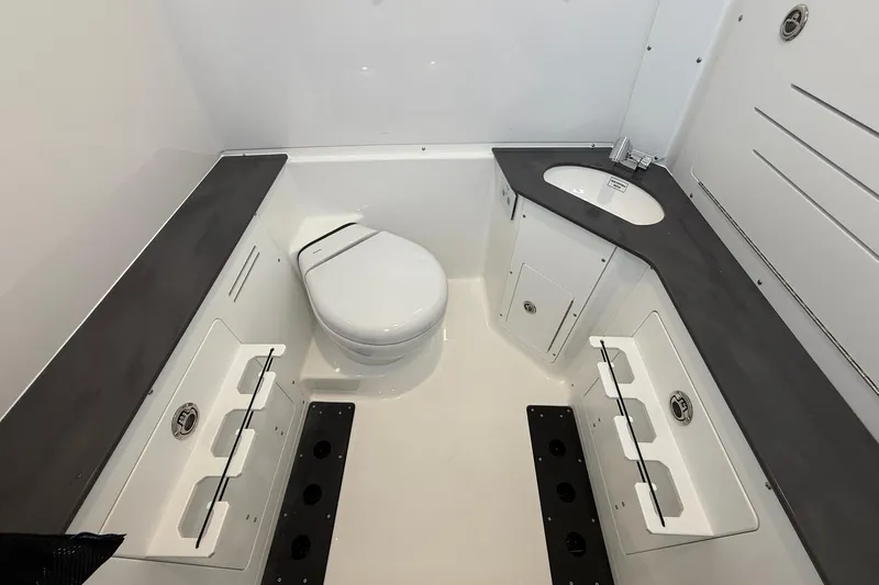 Slide: The Image of 2026 Crevalle 33 CSF boat bathroom with modern fixtures and ample storage space. - 69