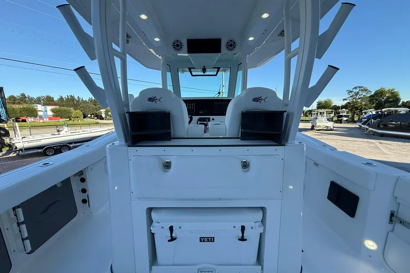 Slide: The Image of 2026 Crevalle 33 CSF boat interior with helm station and Yeti cooler. - 9