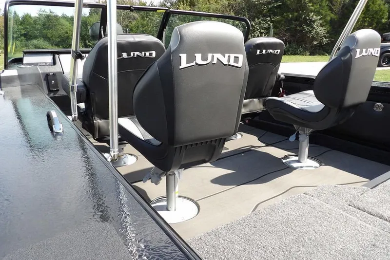 Slide: The Image of 2026 Lund 2075 Pro-V Sport boat interior with branded seats and sleek design. - 10