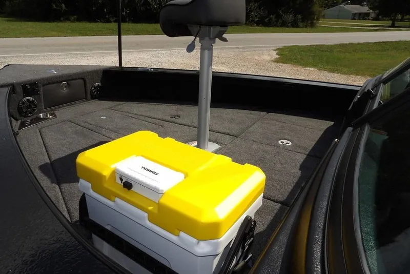 Slide: The Image of 2026 Lund 2075 Pro-V Sport boat interior with yellow cooler and seating. - 11