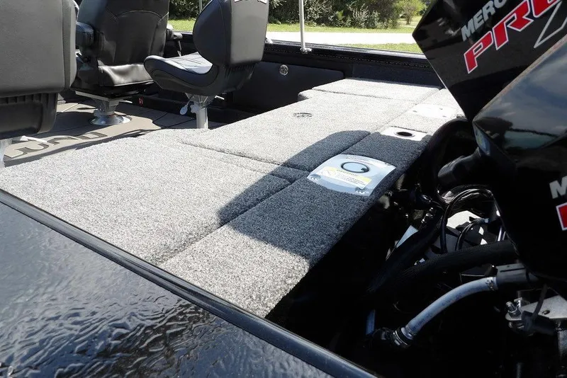 Slide: The Image of 2026 Lund 2075 Pro-V Sport boat interior with seating and engine details. - 12