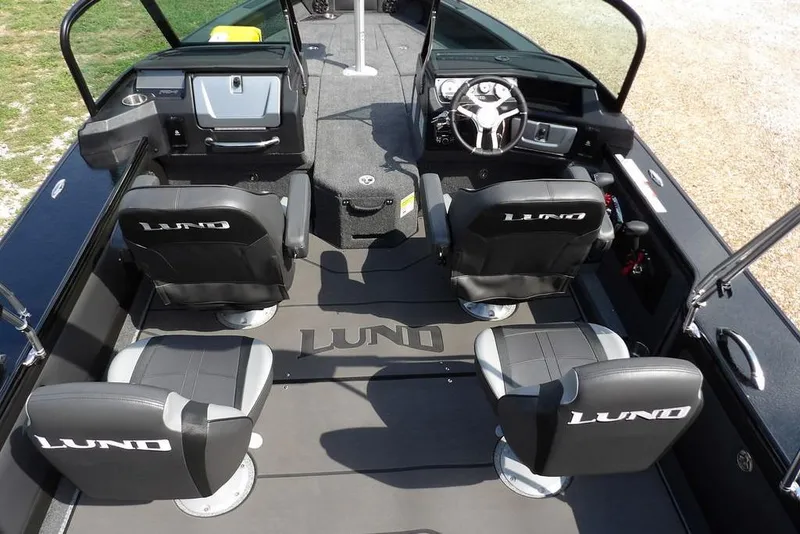 Slide: The Image of Interior of 2026 Lund 2075 Pro-V Sport boat with four seats and steering console. - 22