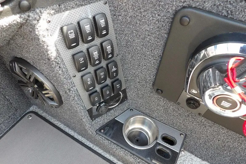 Slide: The Image of 2026 Lund 2075 Pro-V Sport boat interior with control panel and speaker. - 30