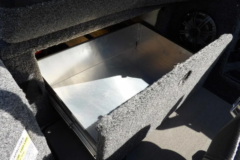 Slide: The Image of 2026 Lund 2075 Pro-V Sport storage compartment with open lid, showcasing spacious interior. - 32