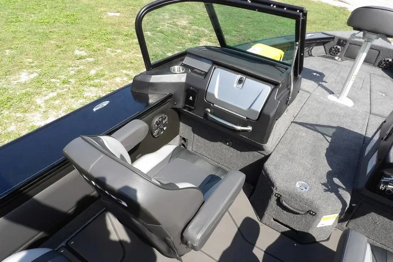 Slide: The Image of Interior of 2026 Lund 2075 Pro-V Sport boat, featuring seating and dashboard. - 36