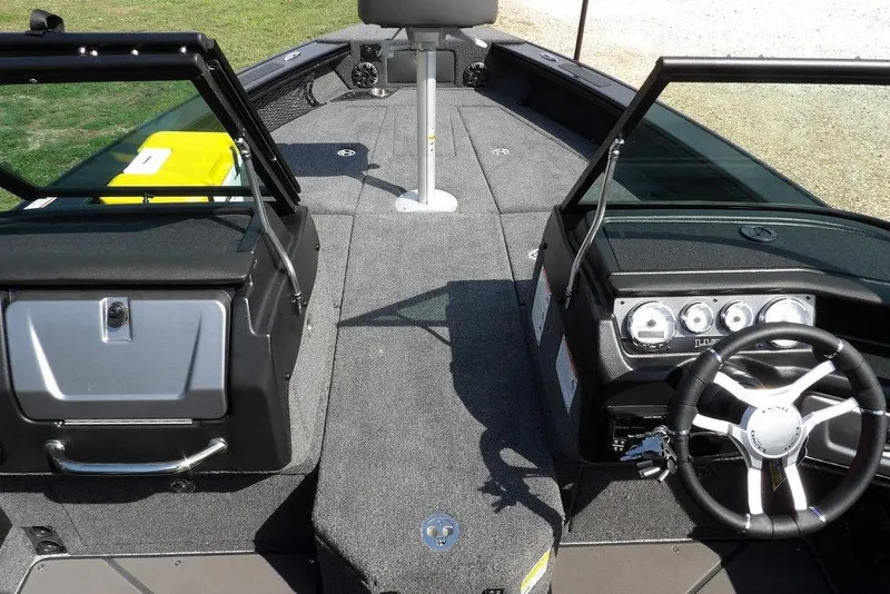 Slide: The Image of 2026 Lund 2075 Pro-V Sport boat interior with steering wheel and dashboard. - 38