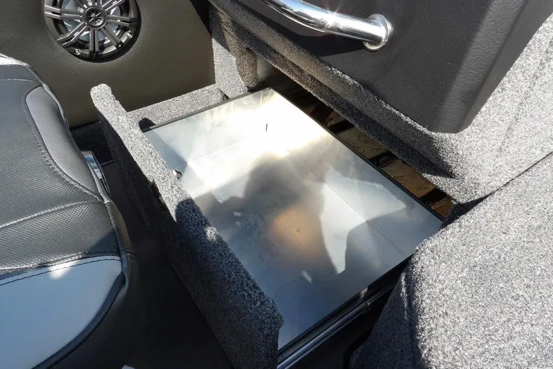 Slide: The Image of 2026 Lund 2075 Pro-V Sport interior storage compartment with speaker and seat detail. - 40