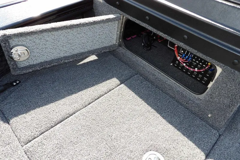 Slide: The Image of 2026 Lund 2075 Pro-V Sport boat interior with open storage compartment and wiring. - 48