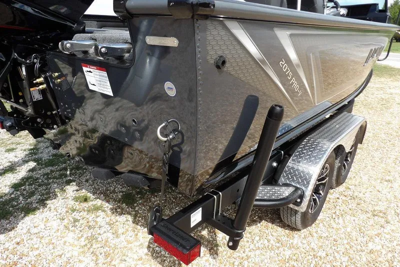 Slide: The Image of 2026 Lund 2075 Pro-V Sport boat on trailer, rear view, metallic finish. - 60