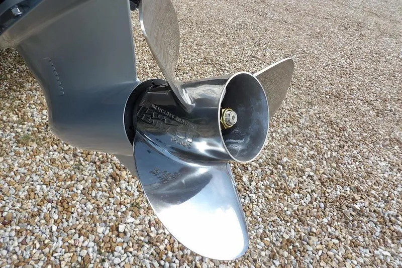 Slide: The Image of Close-up of a Mercury Marine propeller on a 2026 Lund 2075 Pro-V Sport boat. - 63