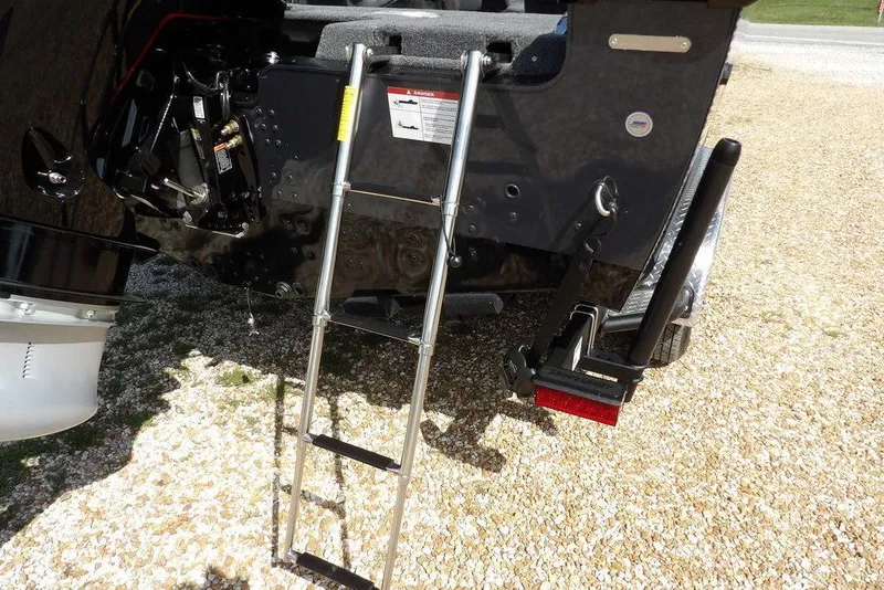 Slide: The Image of 2026 Lund 2075 Pro-V Sport boat with ladder and motor detail. - 64