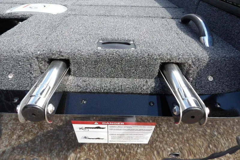 Slide: The Image of 2026 Lund 2075 Pro-V Sport boat with carpeted deck and stainless steel components. - 66